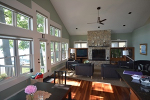 Bostwick Lake Cottage, view of living area looking southeast, views of lake to the left. Lofty ceiling lines