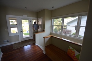 Bostwick Lake Cottage, view of entrance and stairs to lower level. Clean lines, windows to bring in light.