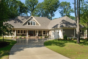 West Michigan Empty Nest House, a view of the front entrance porch, with garage wing to the left.
